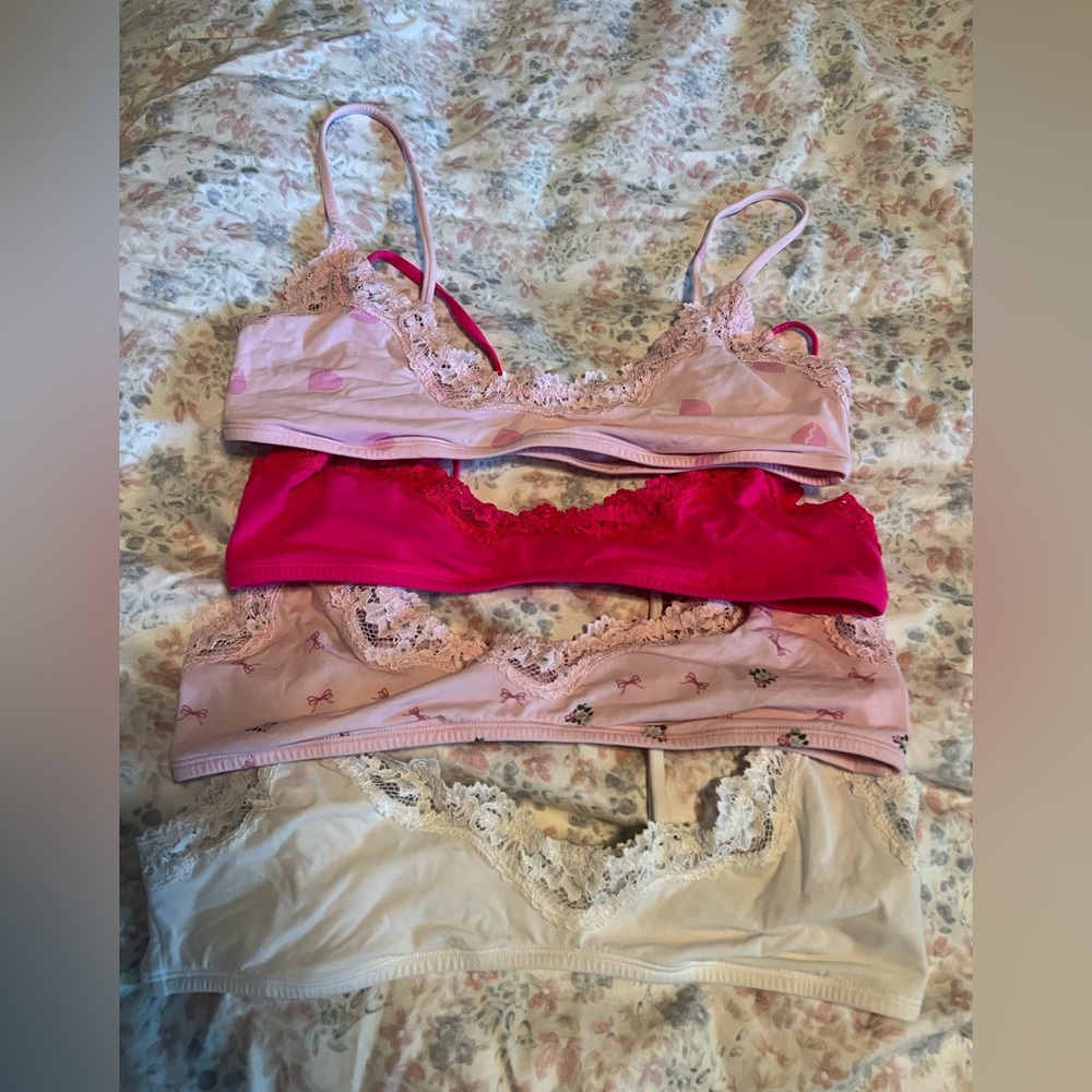SKIMS Pink and Cream Lace Bralette Collection